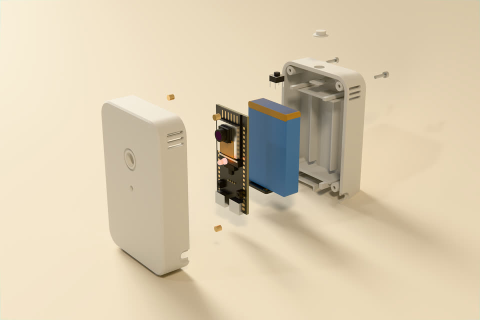 Exploded view on a studio sweep: the front tray, the board with its camera, the blue cell, the rear tray with its ribs and bosses, the button cap and the screws.